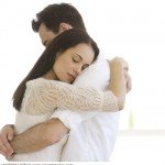 Couple hugging indoors